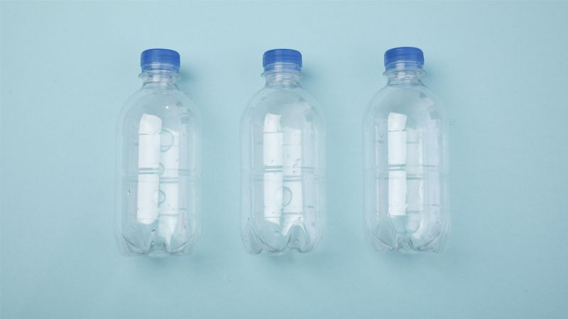 plastic water bottles on blue background