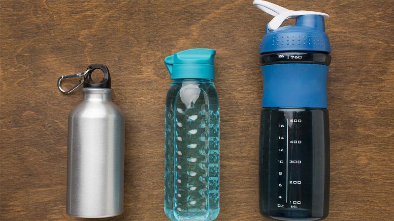thermos and fitness bottles of water